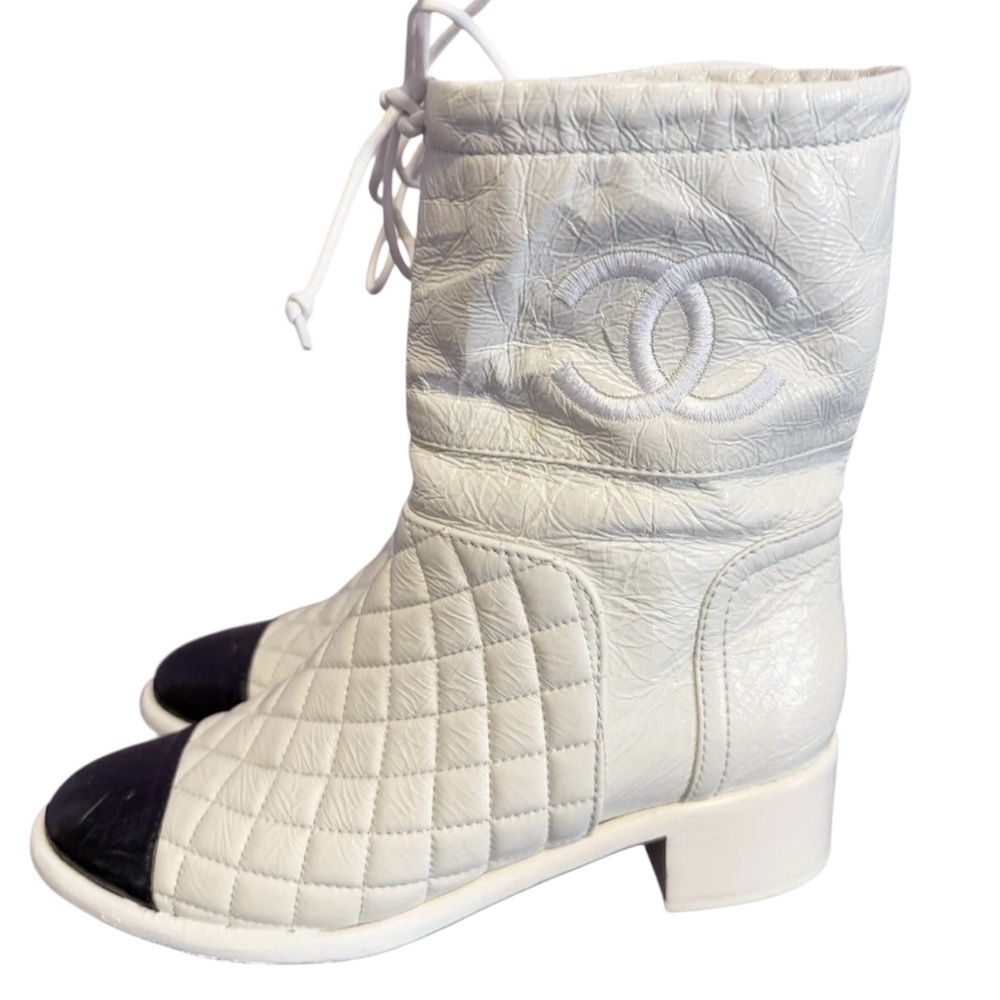 Chanel white quilted black cap toes ankle tie boots